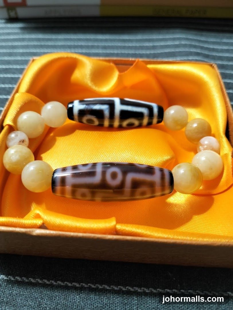 Two bracelets with dzi beads