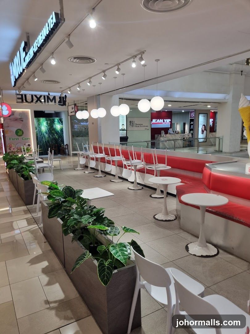 Indoor seating area with plants and tables