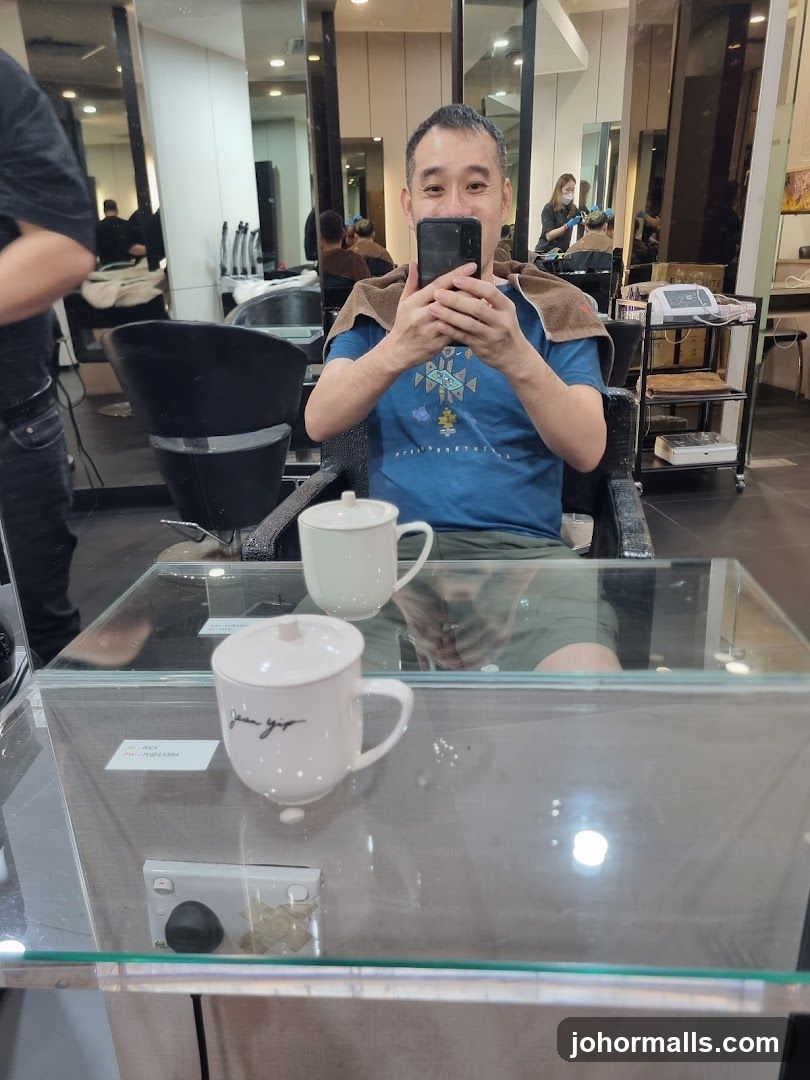 Man taking a selfie in a salon
