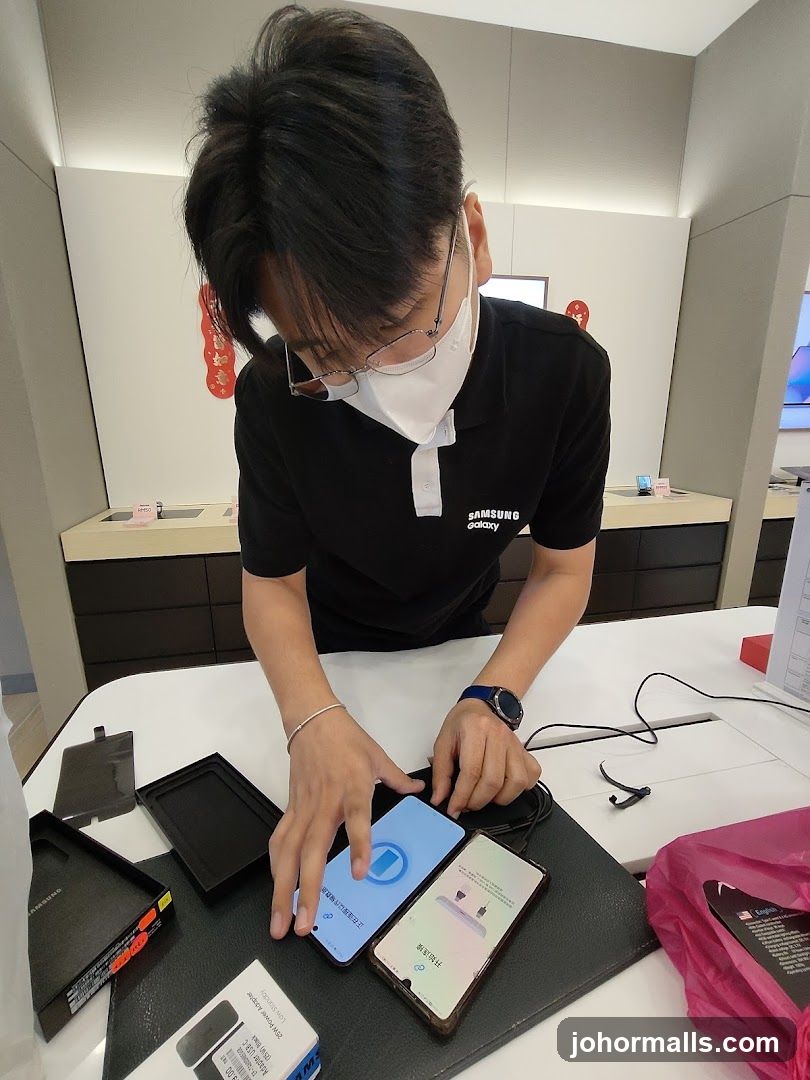 Samsung Store Employee Demonstrating Phones