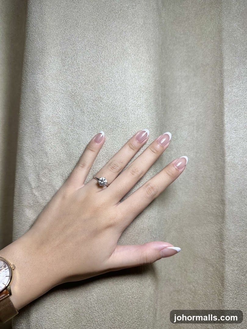 Hand with Ring and French Manicure