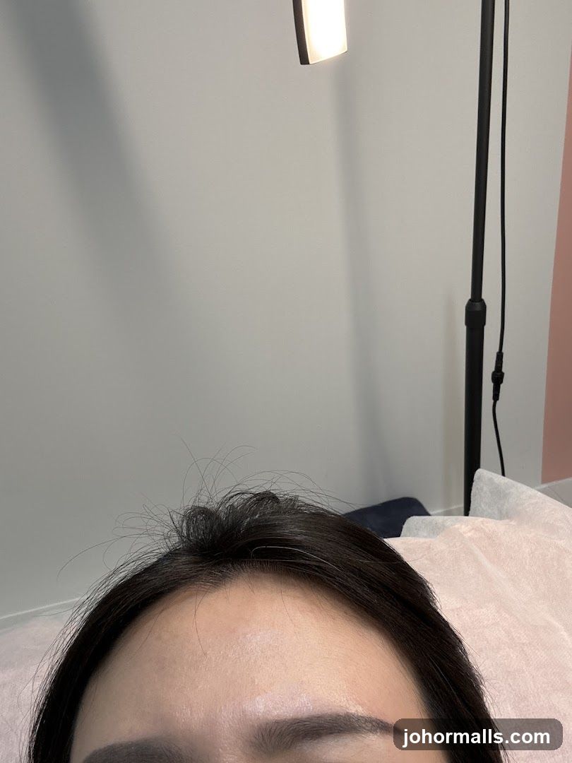 Close-up of a person's forehead and eyebrows