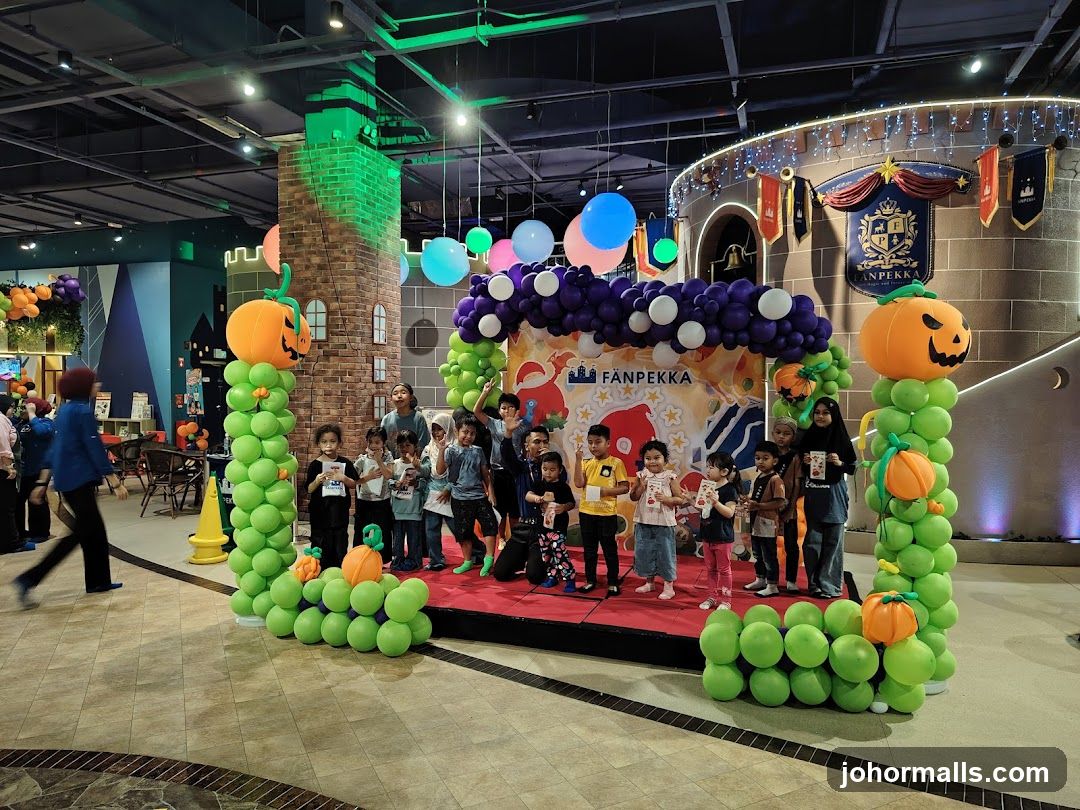 Children on stage with balloon decorations