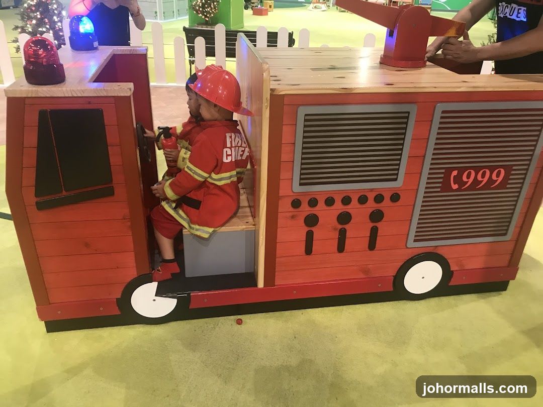 Children playing in a fire truck playhouse