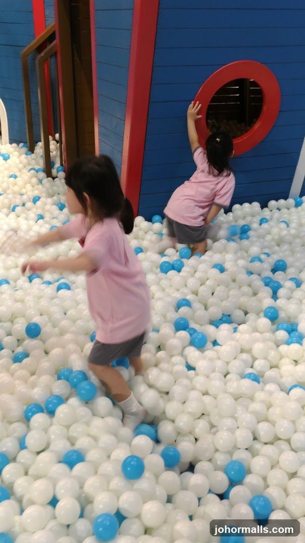 Children playing in a ball pit