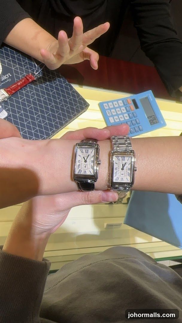Two watches on wrists