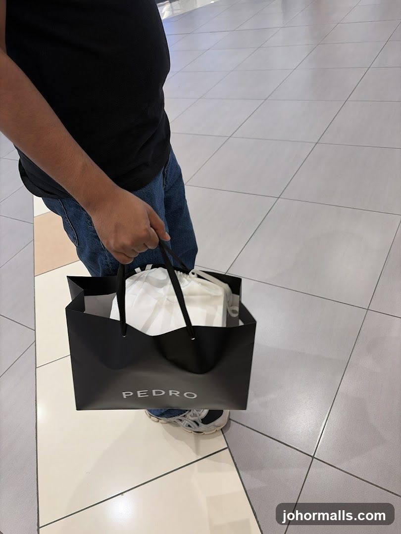 Person holding a shopping bag
