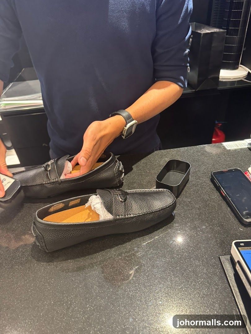 Salesperson showing loafers