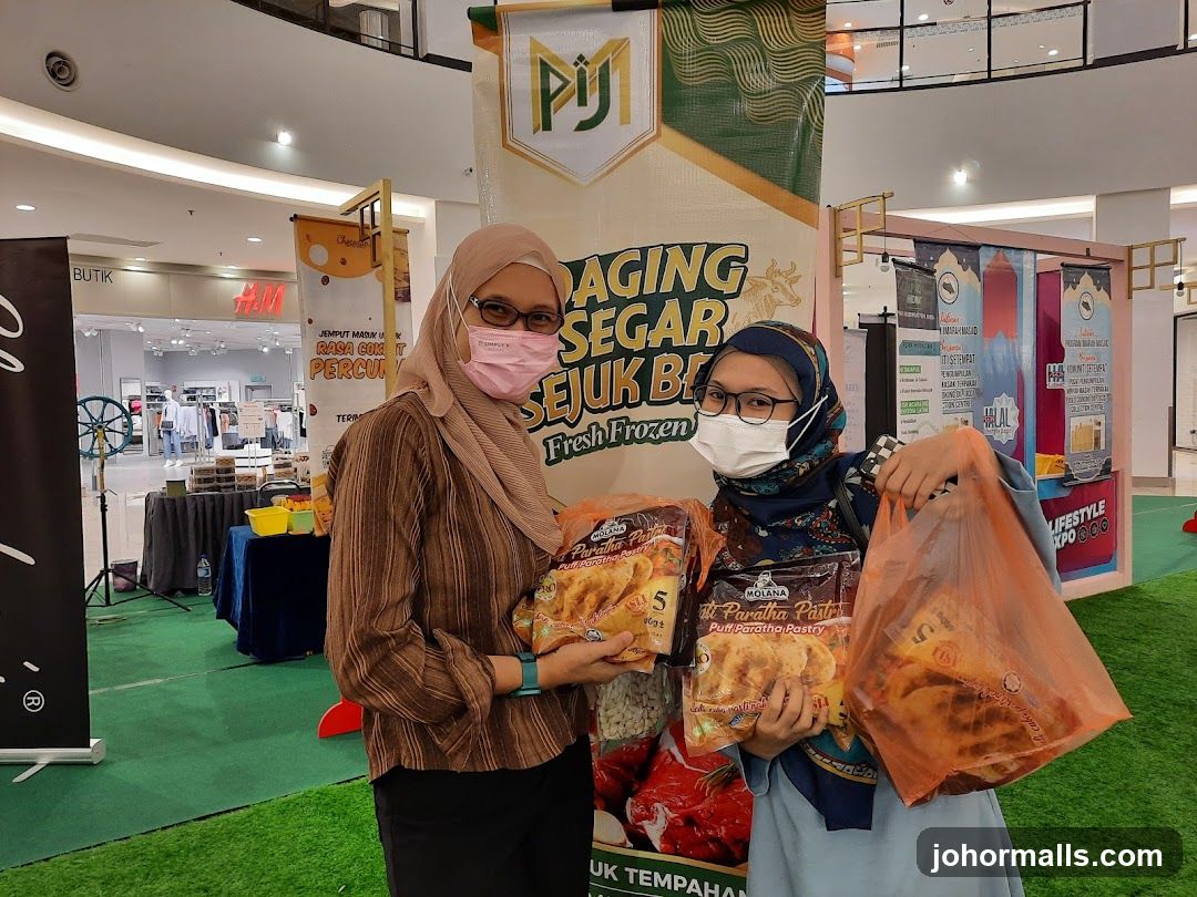 Two women holding frozen food products