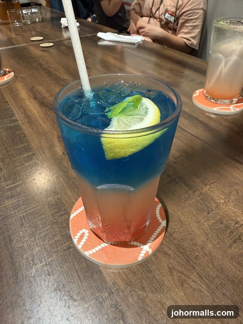 Blue and Red Layered Drink with Lemon and Mint