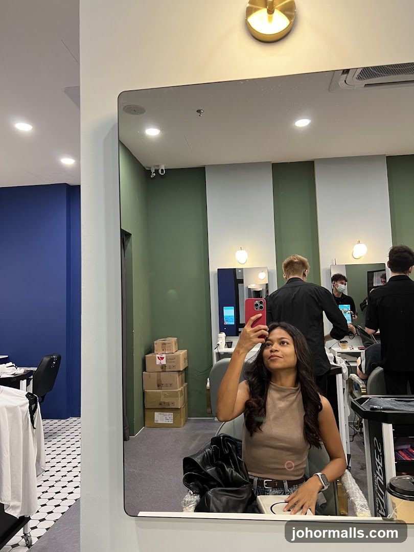 Woman taking a selfie in a salon mirror