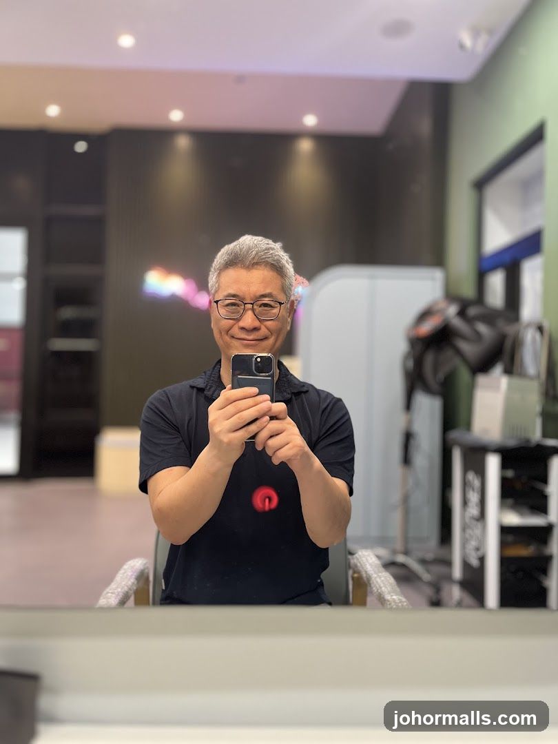 Man taking a selfie in a salon