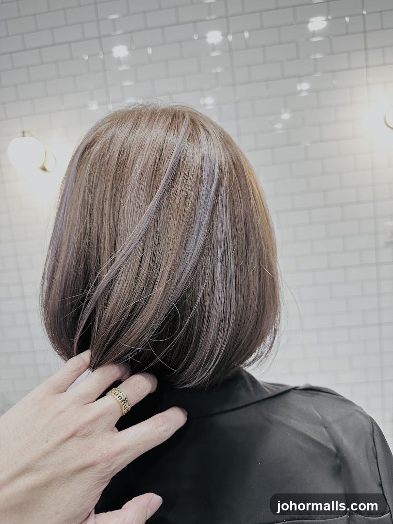 Woman's Bob Haircut with Subtle Purple Highlights