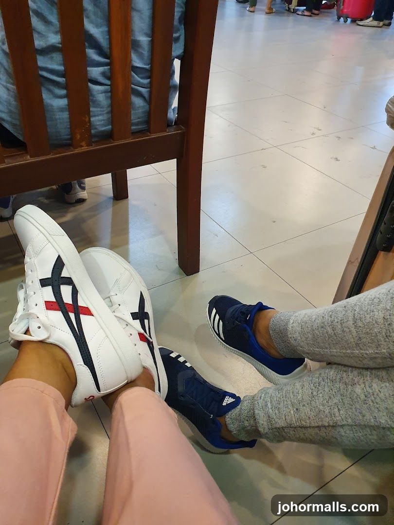 People's Feet Wearing Sneakers