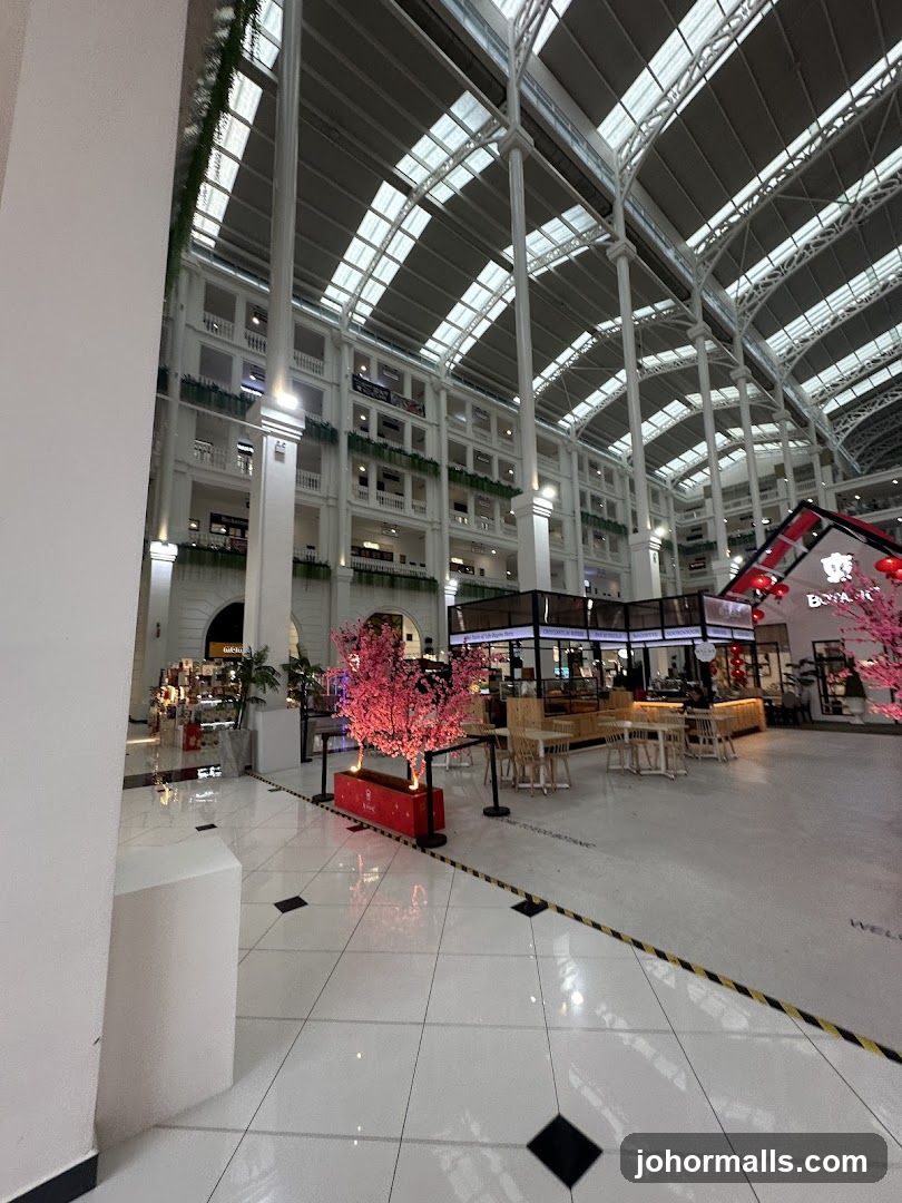 Indoor shopping mall with decorative trees