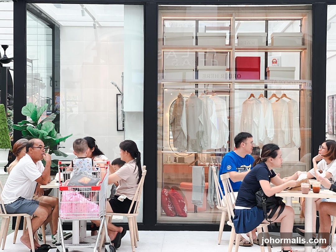 People dining at tables inside a store