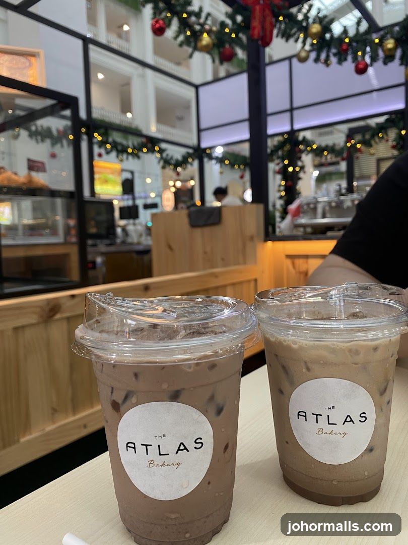 Two iced drinks with bakery logo