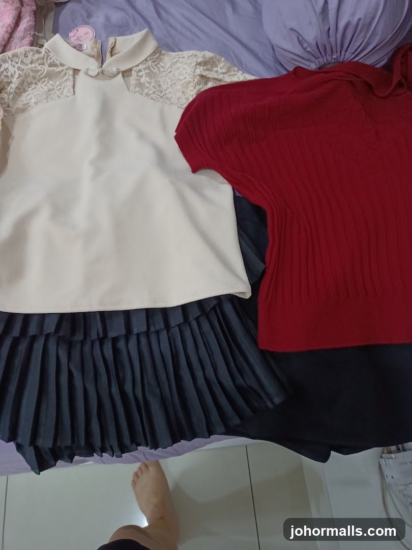 Clothing laid out on a bed