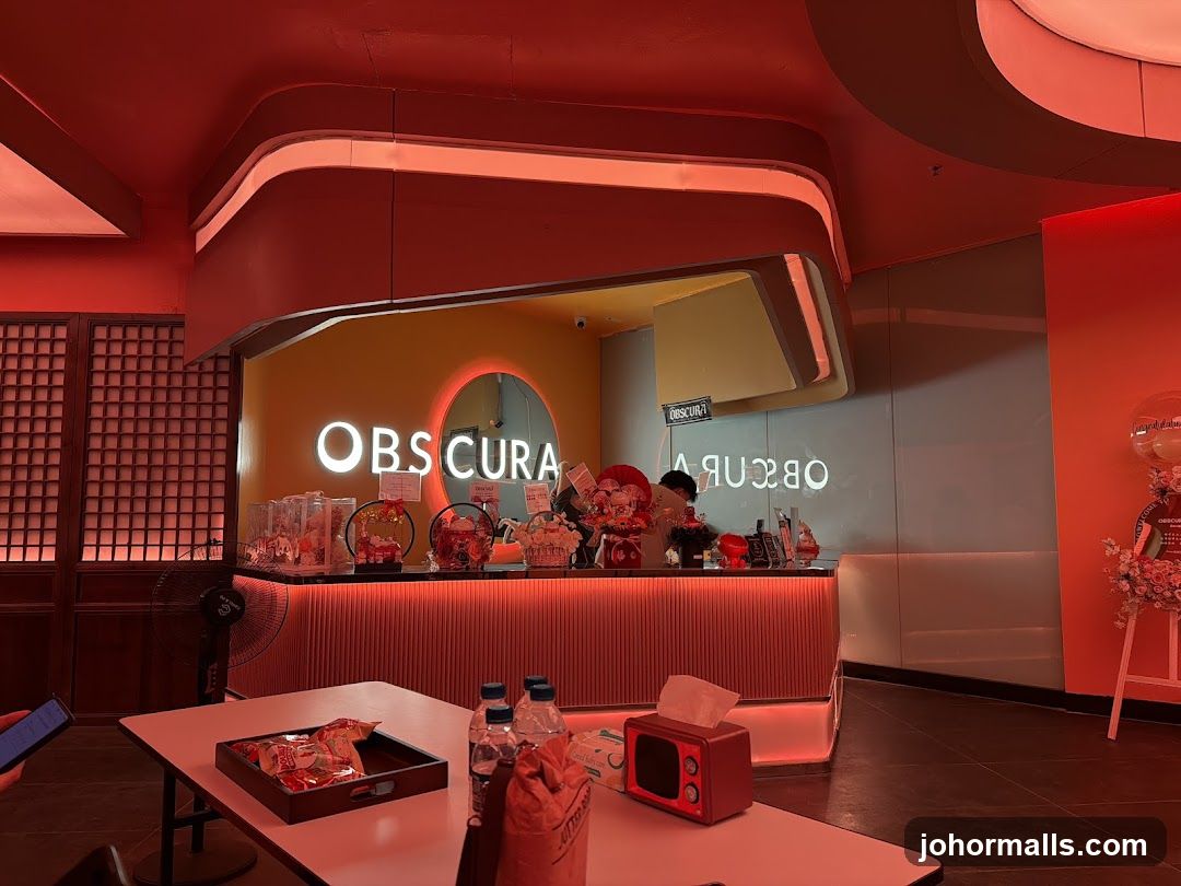Interior of a brightly lit cafe with a counter and seating area