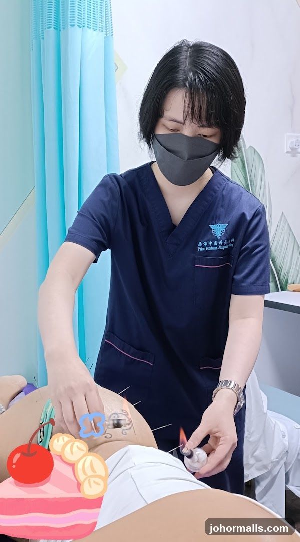 Acupuncturist performing moxibustion