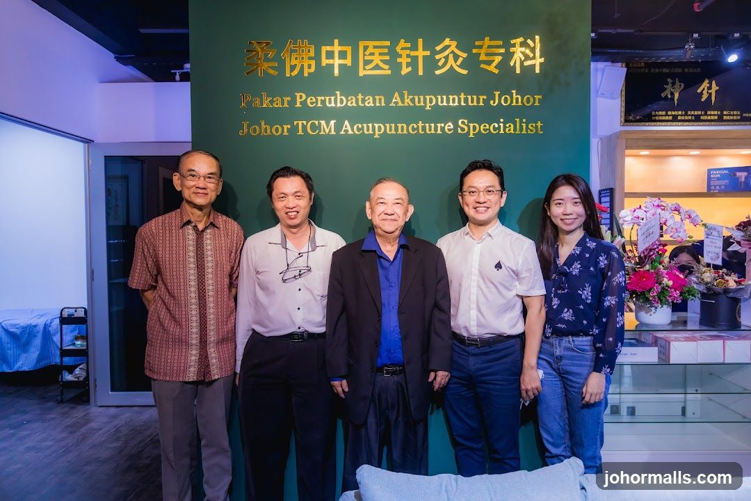 Group Photo in front of Acupuncture Specialist Signage