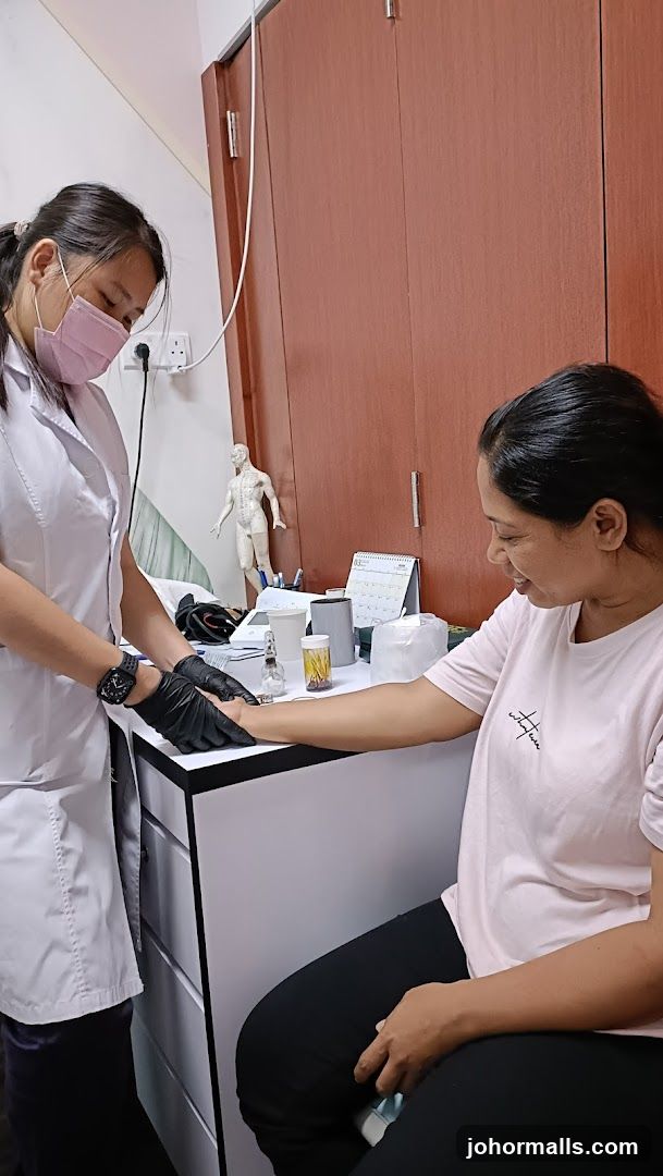 Acupuncturist treating a patient