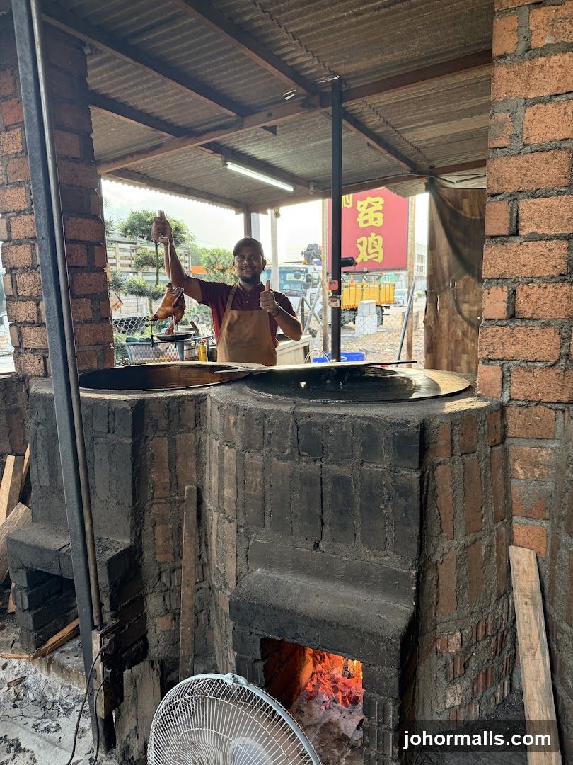 Man holding roasted duck