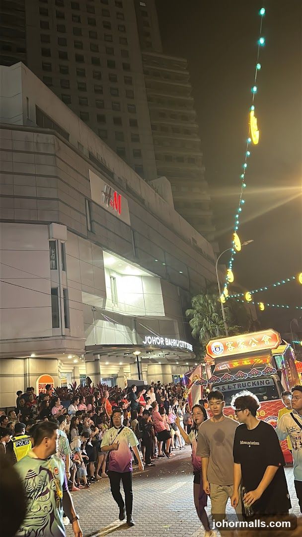 Night Parade with Crowd and Building