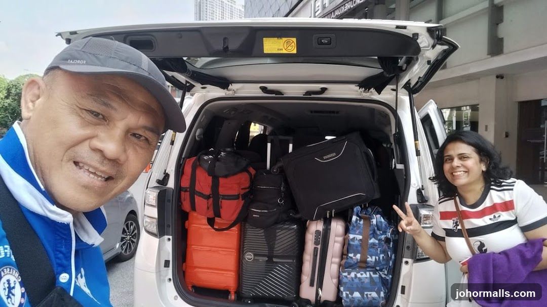 People loading luggage into a car