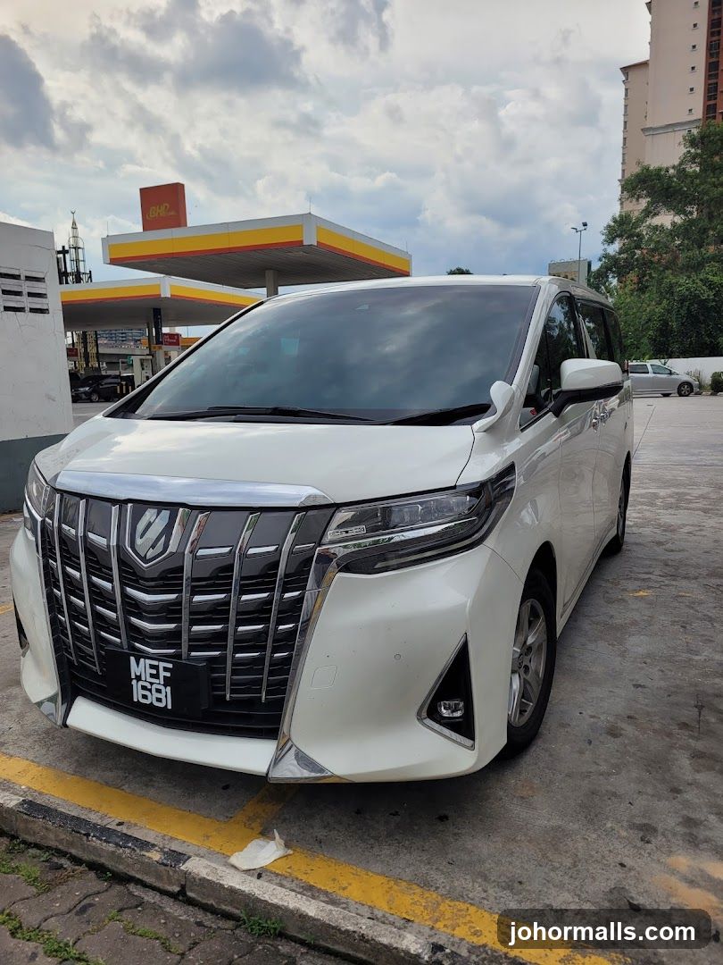 White MPV at Gas Station