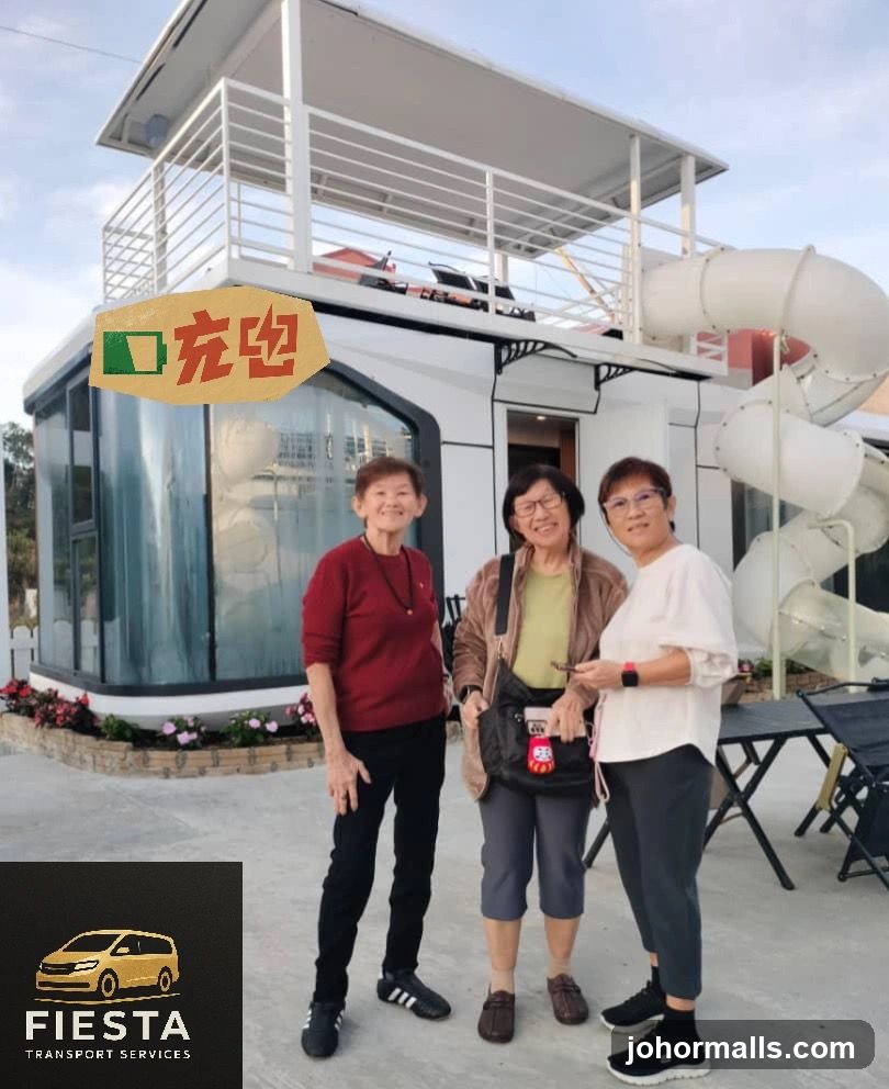Three women posing in front of a unique building