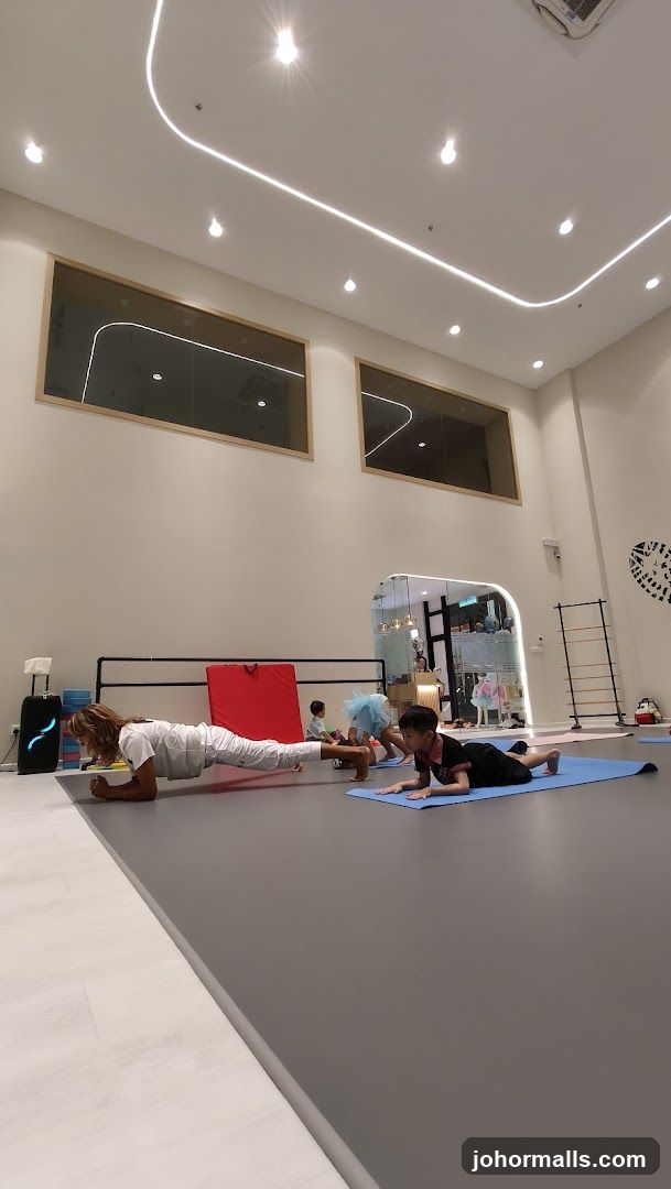Children and adult doing exercises in a studio