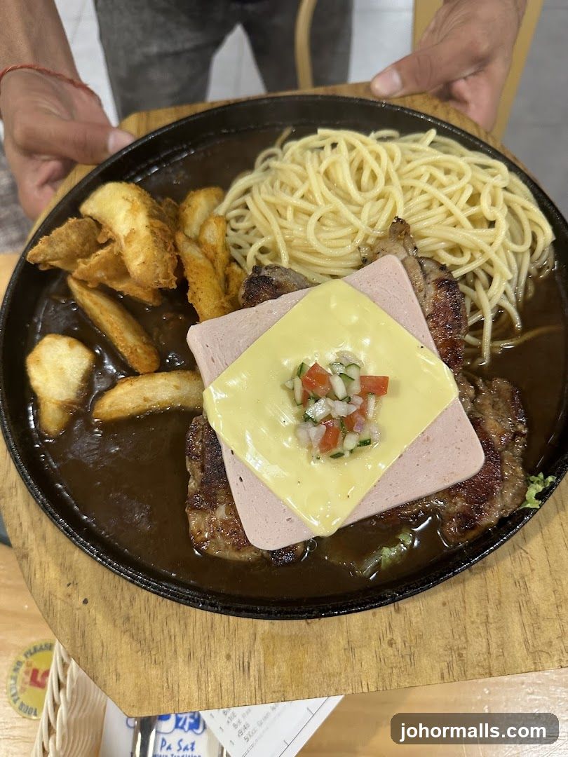 Sizzling Platter with Spaghetti and Fries