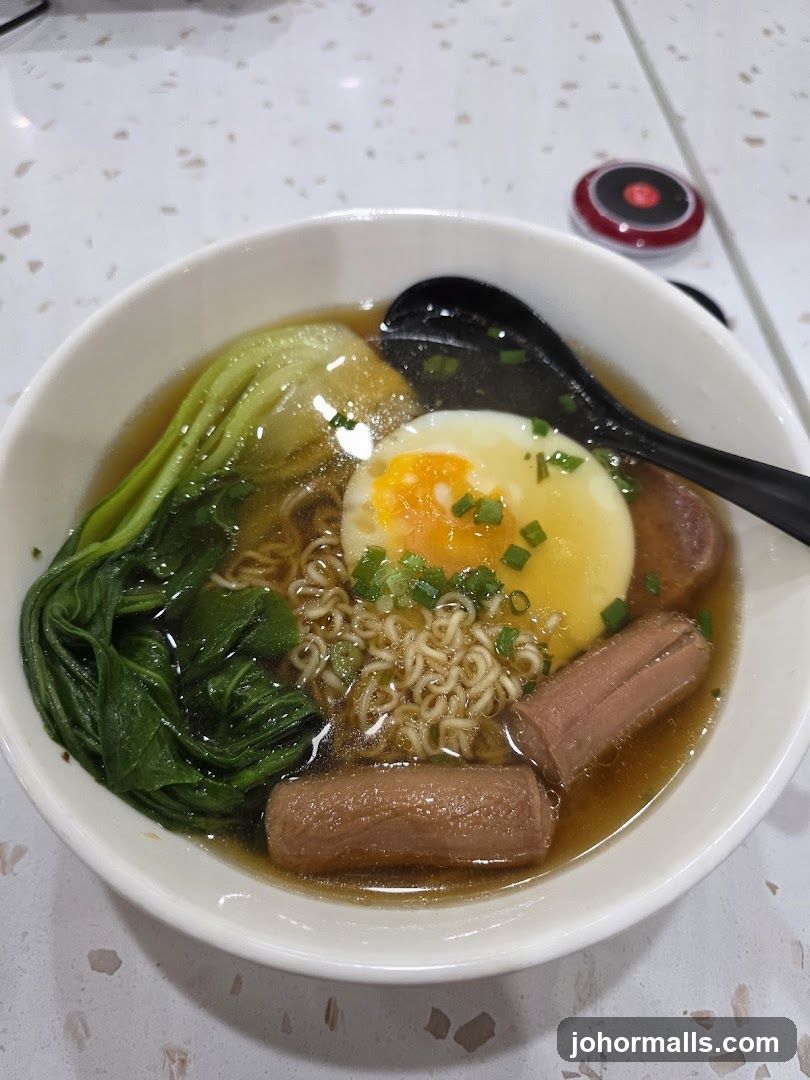 Noodle Soup with Egg and Sausages