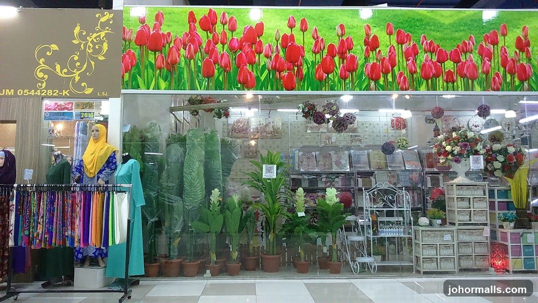 Storefront with floral decorations and clothing displays
