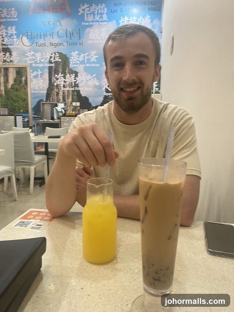 Man with drinks at Hanoi Chef