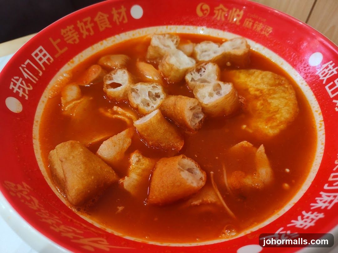 Bowl of Soup with Fried Dough