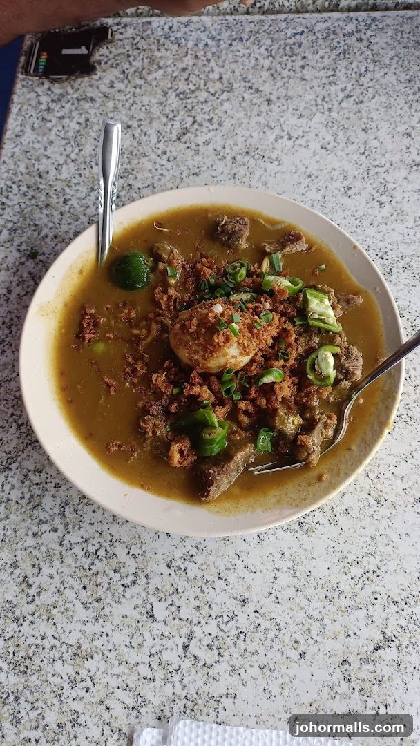 Bowl of Stew with Egg and Garnish