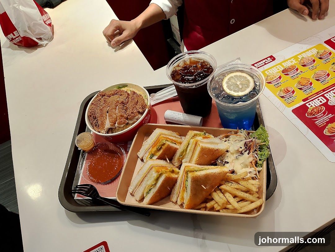 Meal Tray with Sandwiches, Fried Chicken Rice, Fries, and Drinks