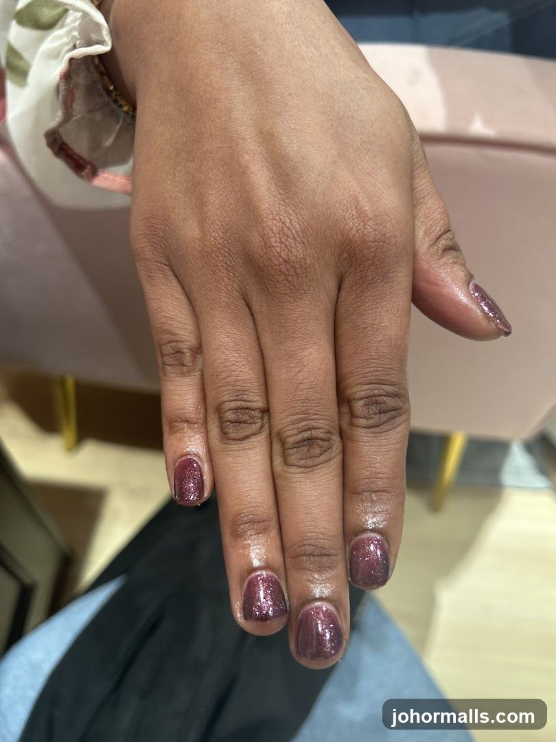 Hand with Glitter Nail Polish