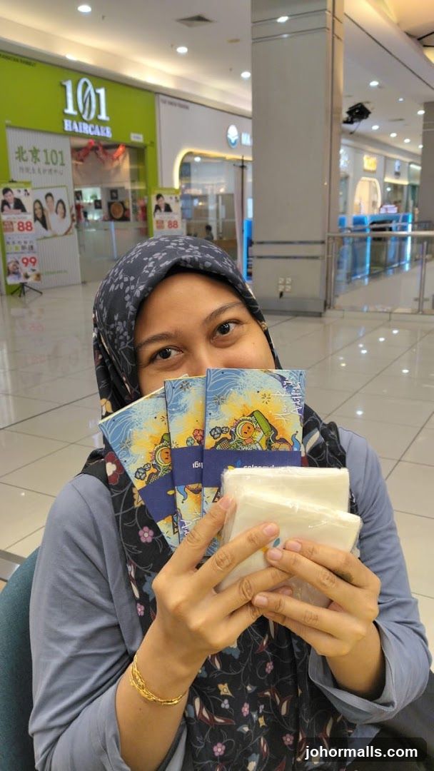 Woman holding promotional items