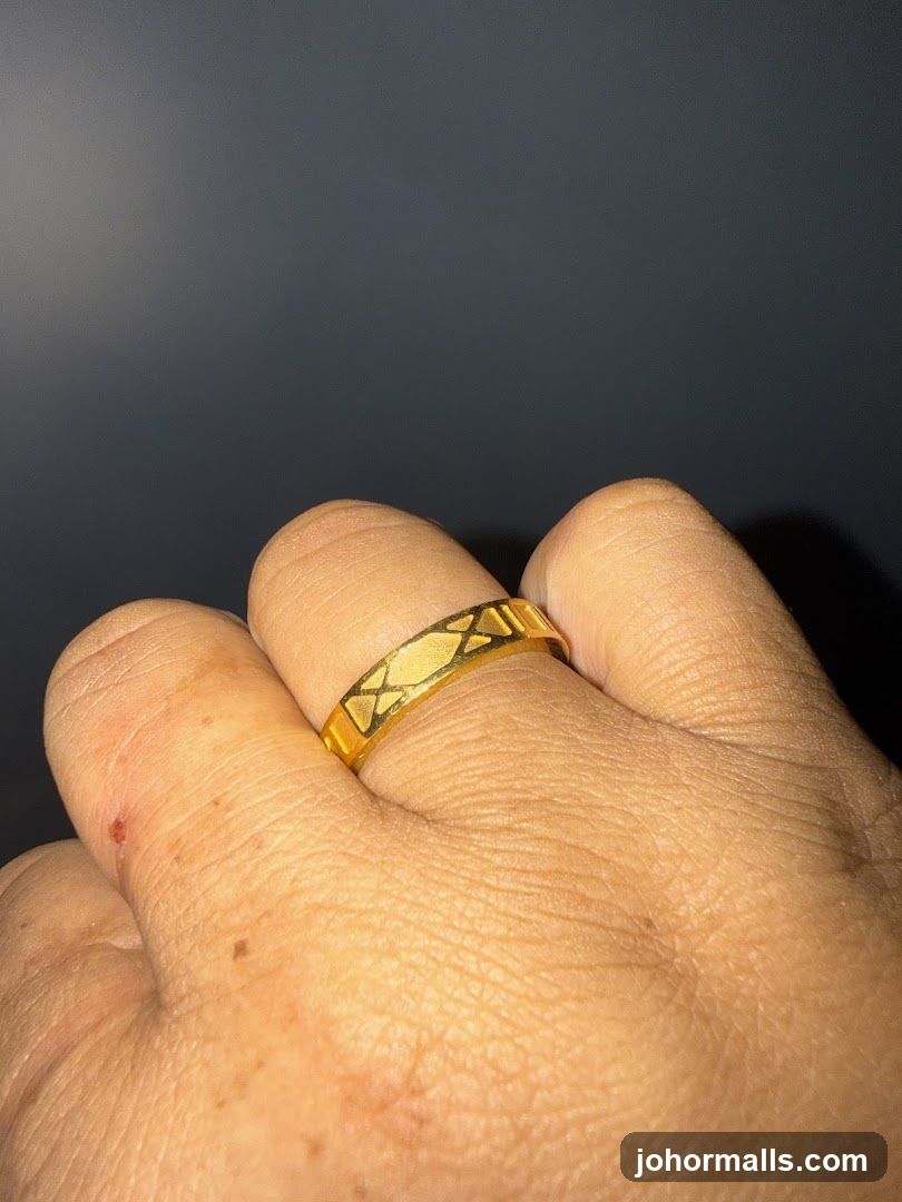Gold ring on finger