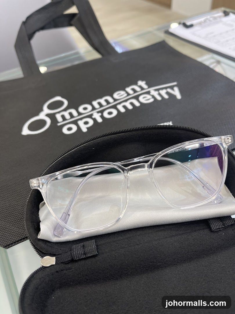Eyeglasses in a case with branded bag