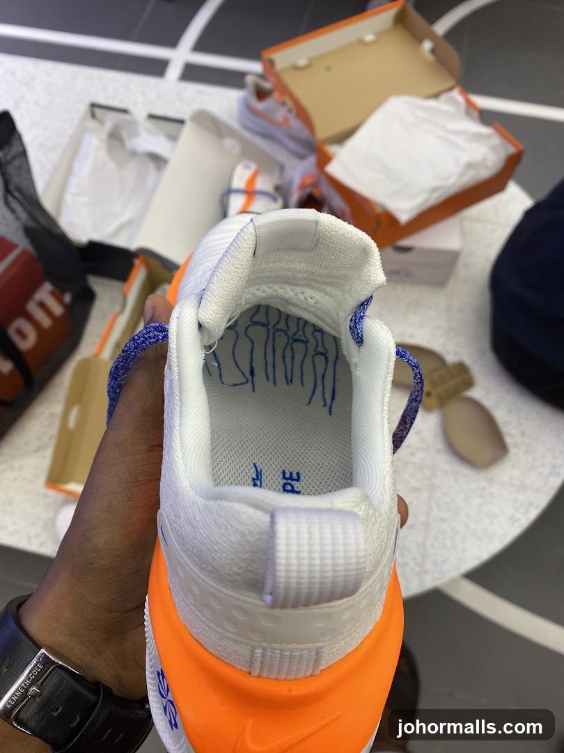 Close-up of a white and orange sneaker
