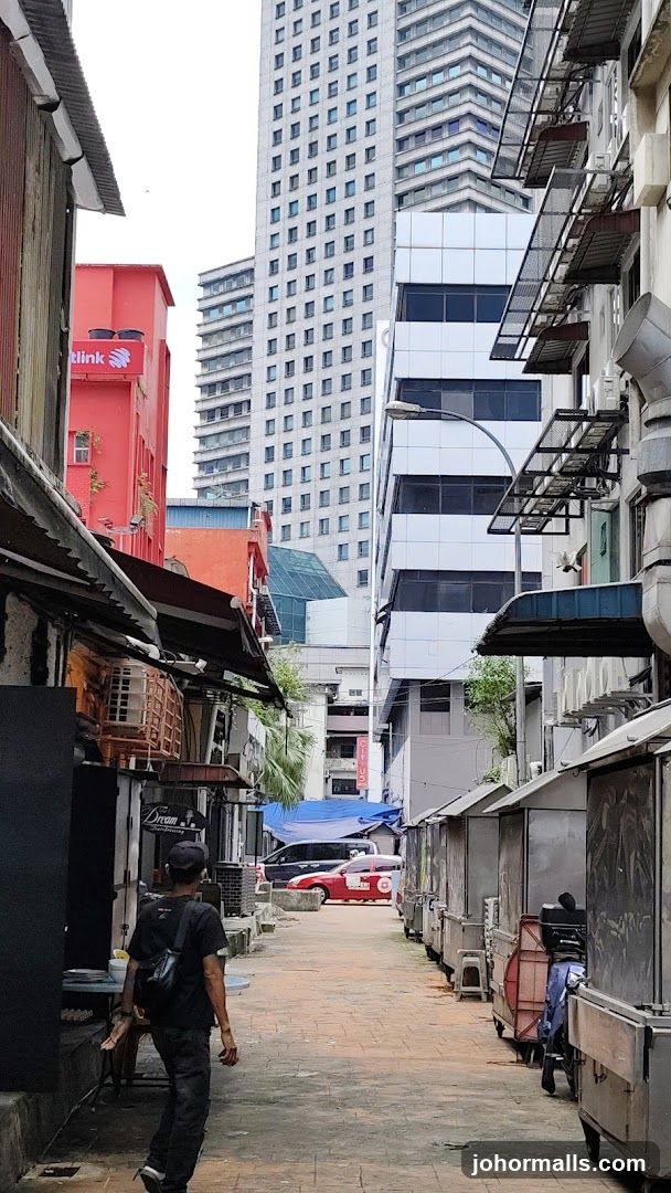 Alleyway with Stalls and Tall Buildings