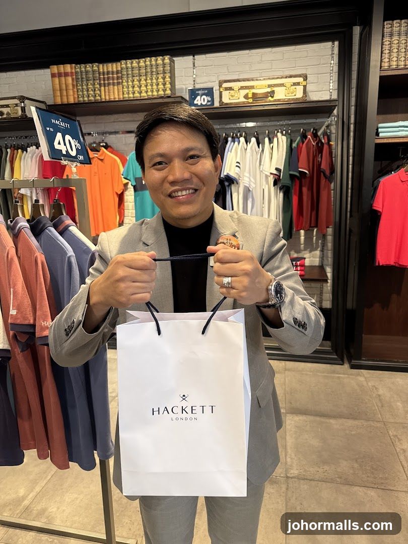 Man holding a shopping bag in a store