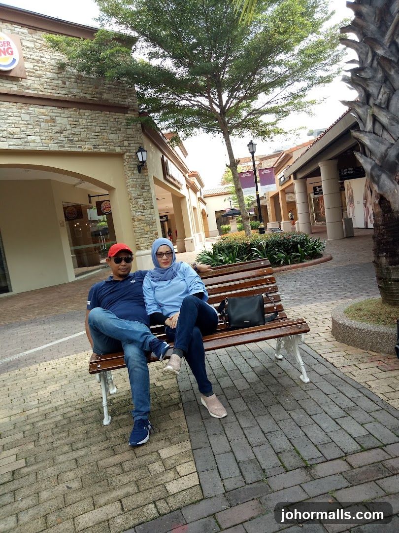 Couple on a bench outside Burger King