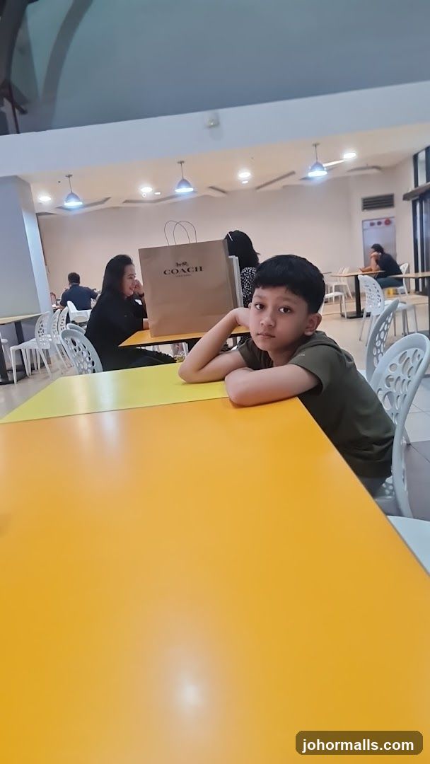 Boy at a table with shopping bag