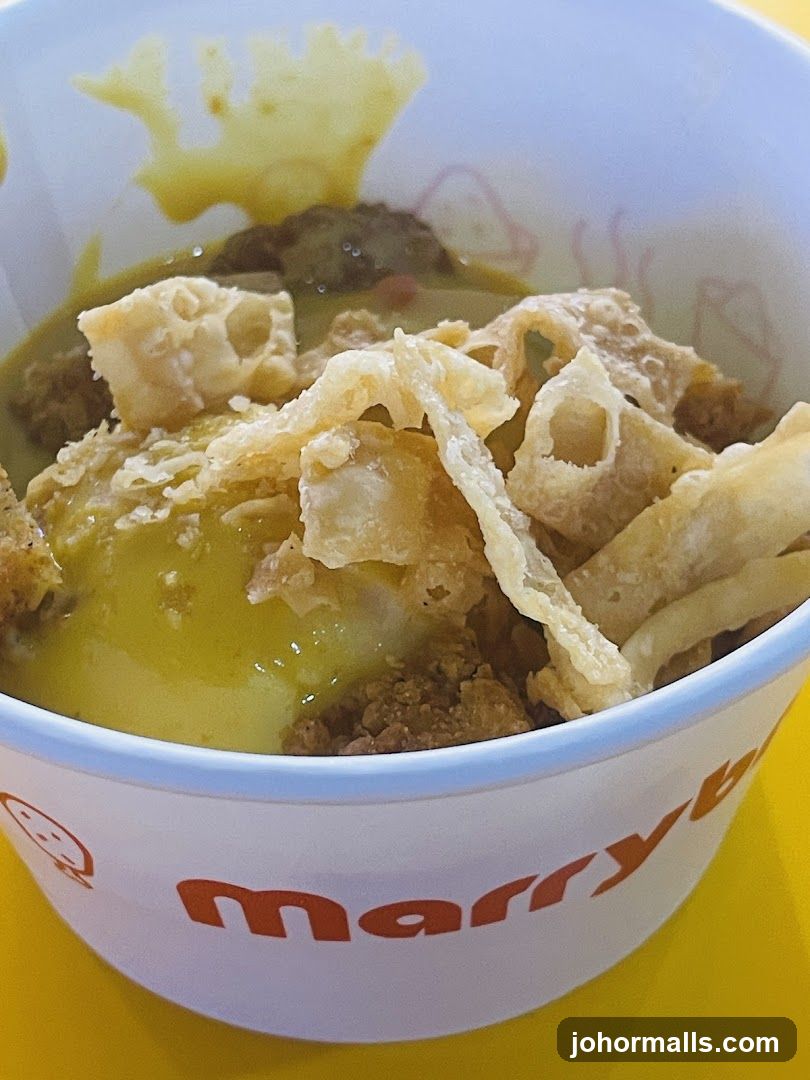 Curry dish in a branded cup