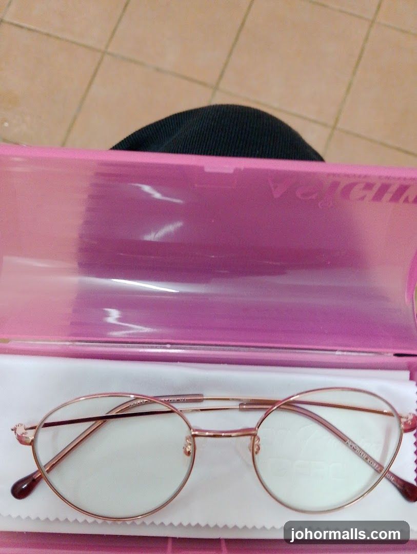 Eyeglasses in a pink case